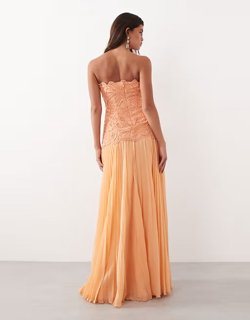 ARRANGE abstract cutwork bandeau maxi dress with pleat skirt in soft peach