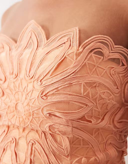ARRANGE abstract cutwork strapless maxi dress with pleated skirt in soft peach